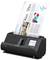 Un scanner nero Epson sta acquisendo un documento a colori con grafici e statistiche. Lo scanner ha un piccolo display con simboli.
