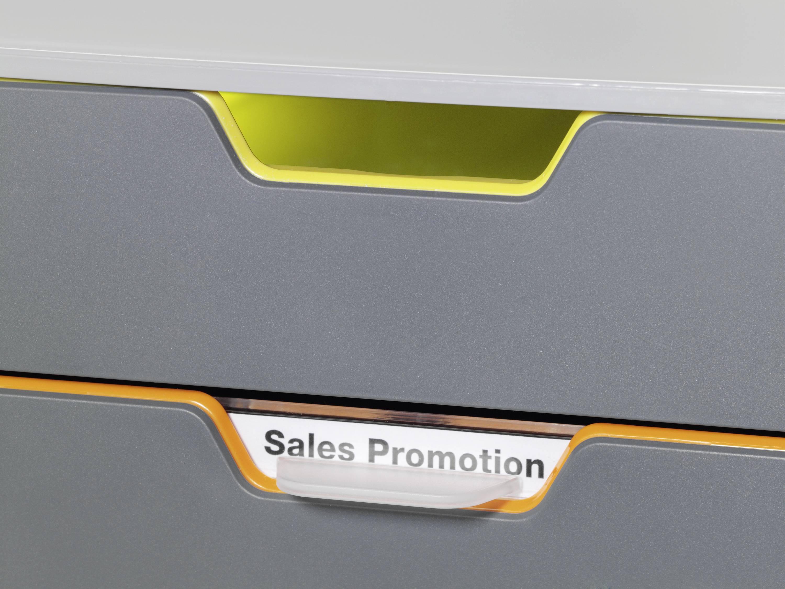 Cassetto grigio con accenti gialli e arancioni. Etichetta sulla cassetta inferiore con la scritta 'Sales Promotion'.