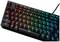 Tastiera da gaming nera con illuminazione RGB. I tasti si illuminano in colori spettrali. Modello con cavo.