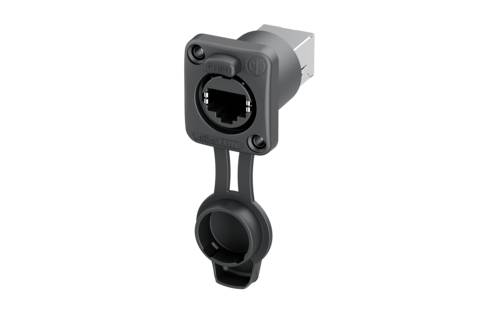 Presa RJ45 grigio-nero con coperchio protettivo rotondo, montabile a parete o su dispositivo, rivolta verso l'osservatore.