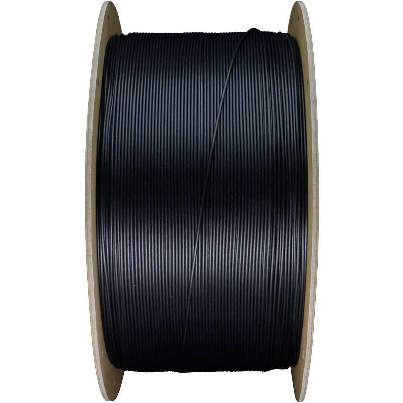 Un grande rocchetto di filamento nero utilizzato per stampanti 3D.