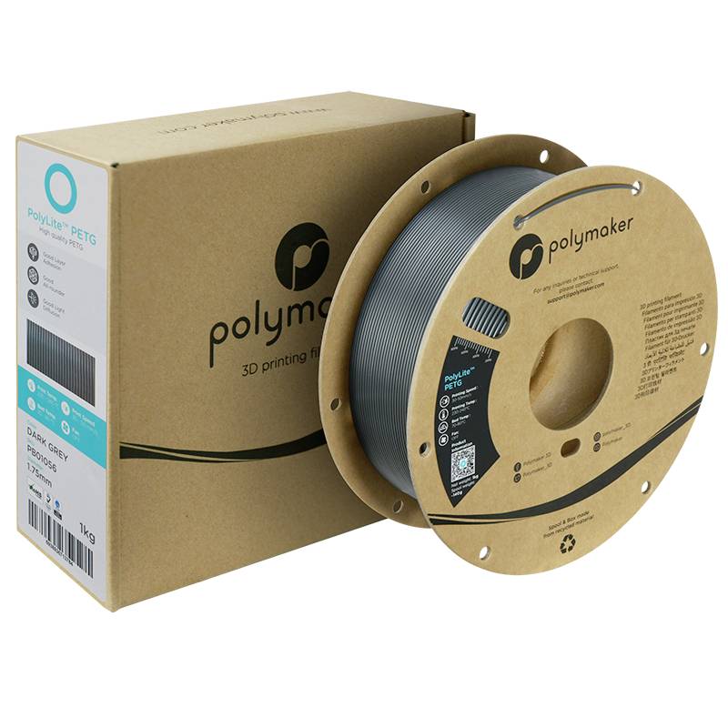 Filamento per stampante 3D: Una bobina di filamento PETG grigio di Polymaker accanto alla relativa confezione. Ideale per lavori di stampa precisi.