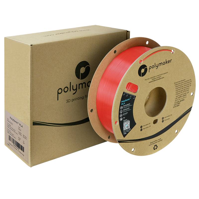 Rotolo di filamento per stampa 3D di Polymaker di colore rosso accanto a una scatola di imballaggio marrone. Adatto per stampa 3D.