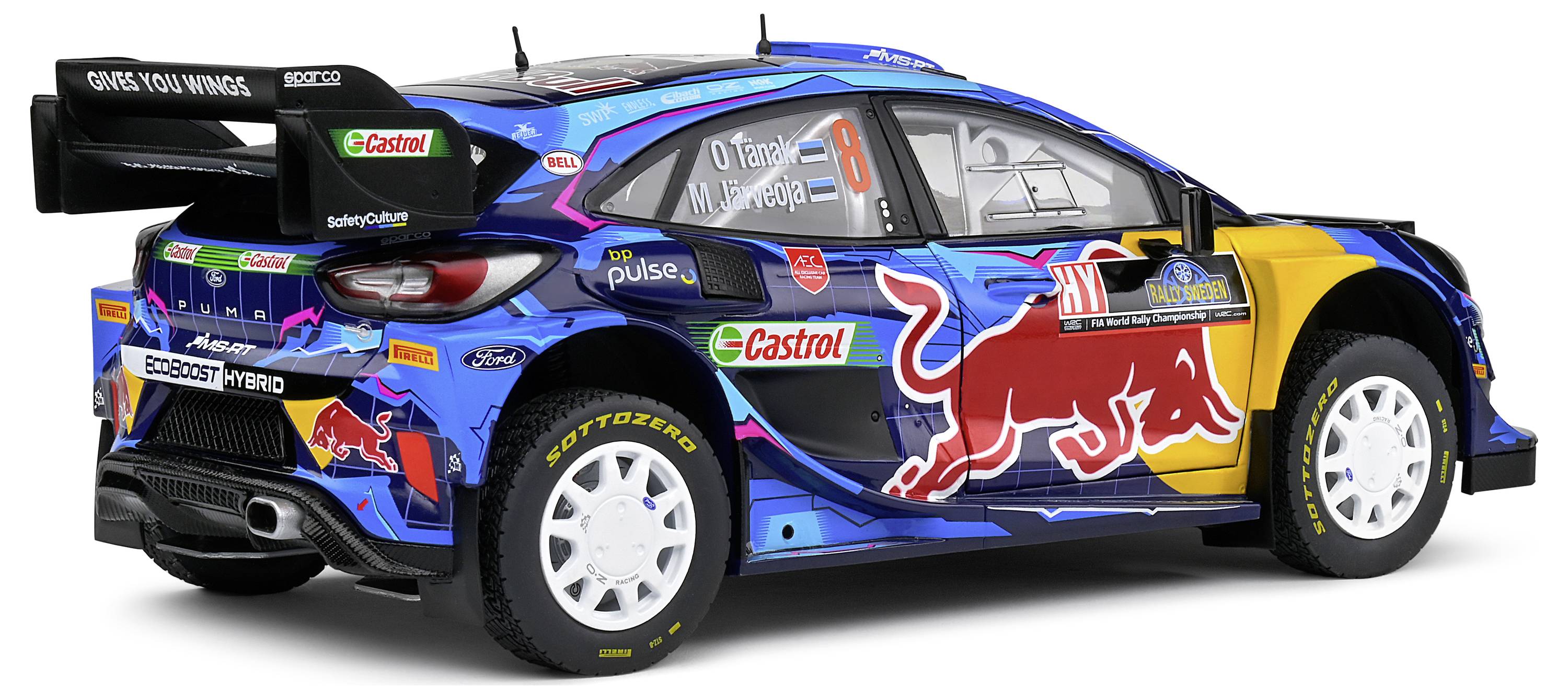 Un'auto da rally blu con loghi degli sponsor, tra cui 'Red Bull' e 'Castrol'. Pagina 8, design alare distintivo.