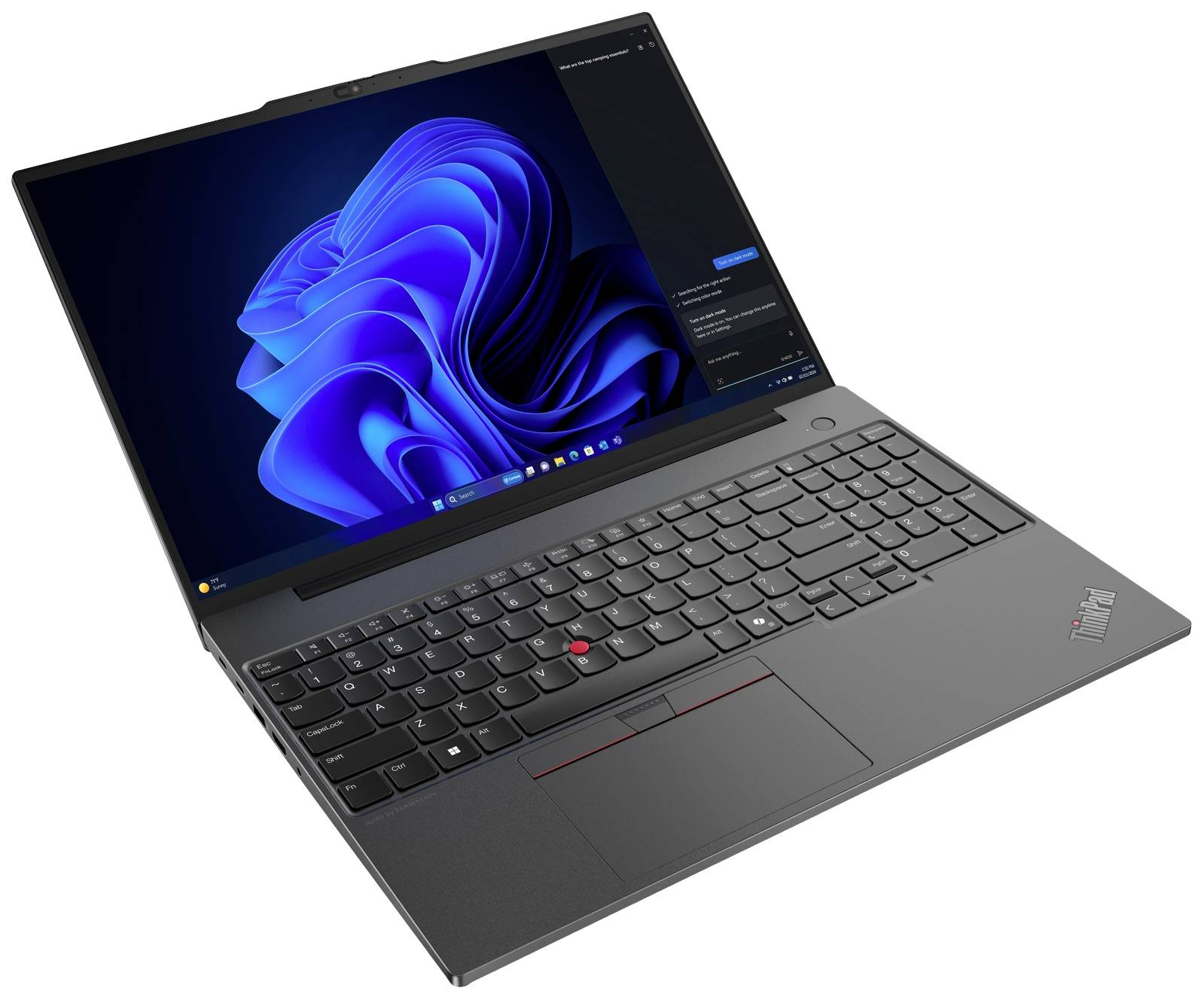 Laptop con tastiera nera e schermo aperto, mostra la schermata di avvio di Windows 11 con sfondo blu, trackpad nero davanti.