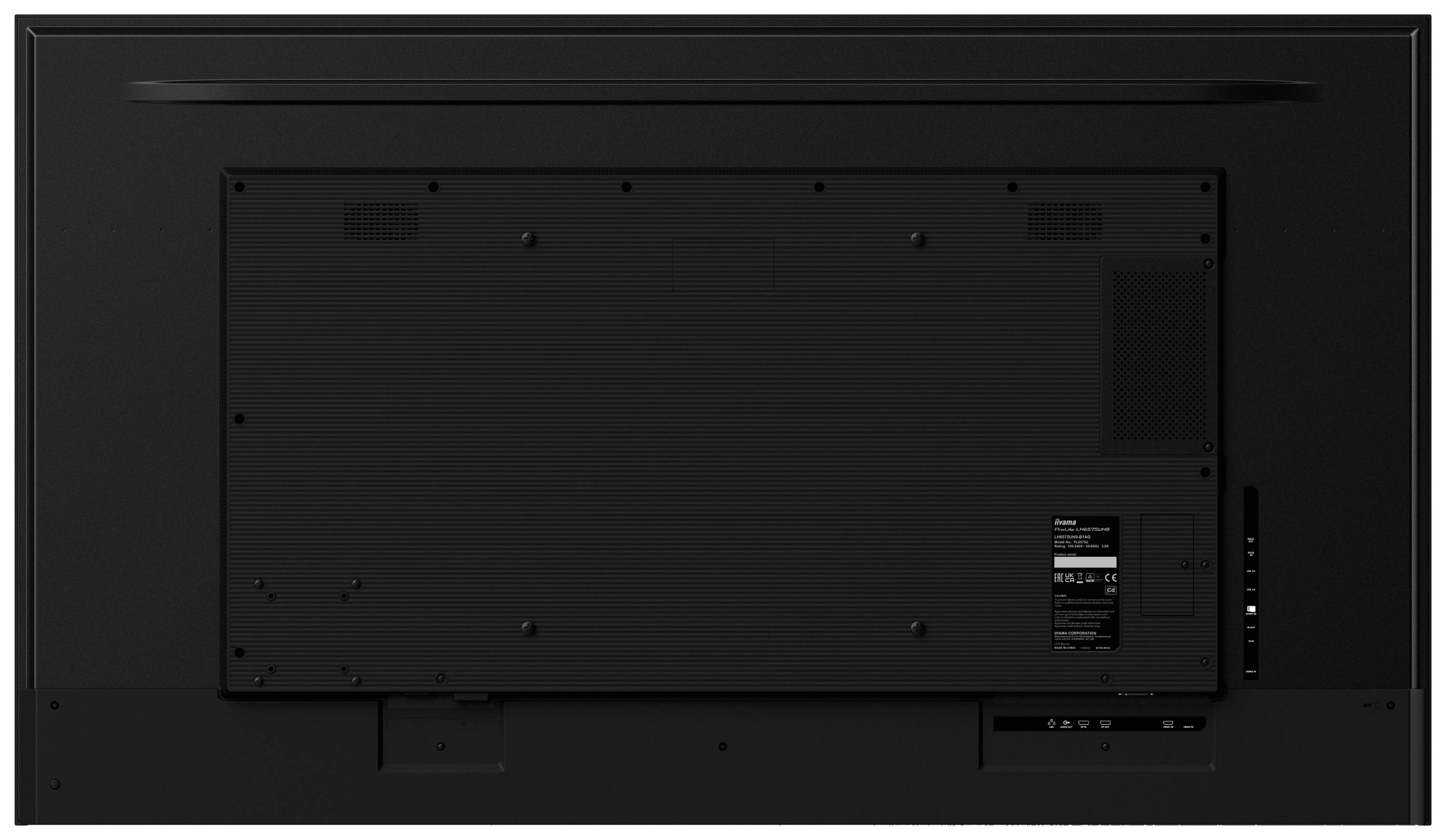 Vista posteriore di un grande televisore con multiple porte di connessione come HDMI e USB, racchiuso in un rivestimento di plastica scura.
