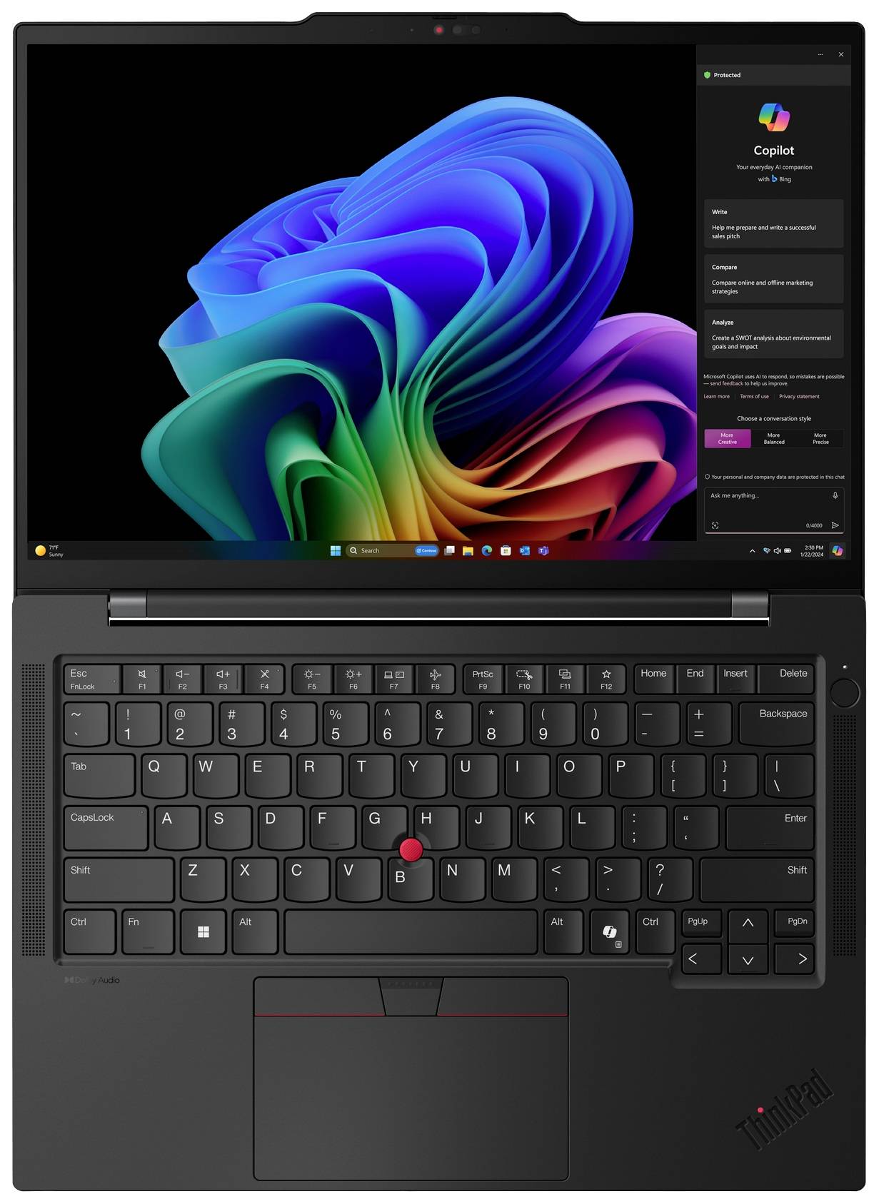 Laptop con schermo aperto, mostra un'interfaccia del sistema operativo colorata; tastiera e trackpad visibili sotto di esso.