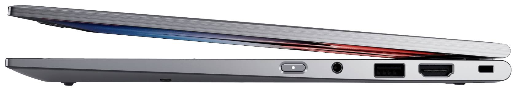 Un laptop semi-aperto con design sottile, scocca argentata e diversi porte sui lati, inclusi HDMI e USB.