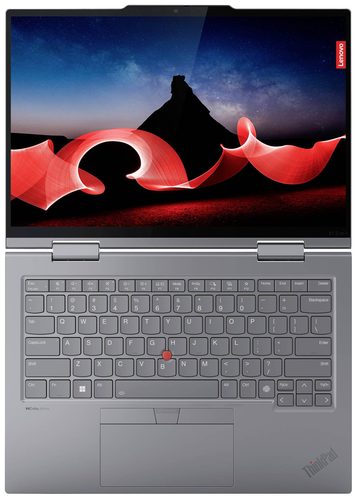 Laptop argentato dall'alto, lo schermo mostra forme curve rosse davanti a una montagna scura e un cielo notturno stellato.