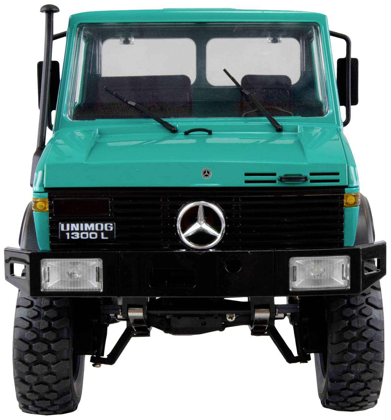Un Unimog 1300 L color turchese visto frontalmente, con grandi pneumatici e il logo Mercedes sul radiatore.