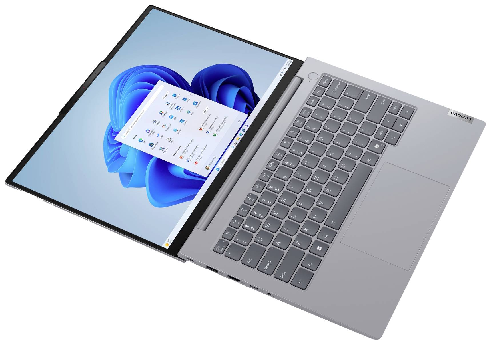 Un laptop grigio con interfaccia Windows, tastiera visibile. Lo schermo mostra il menu di avvio di Windows e design blu.