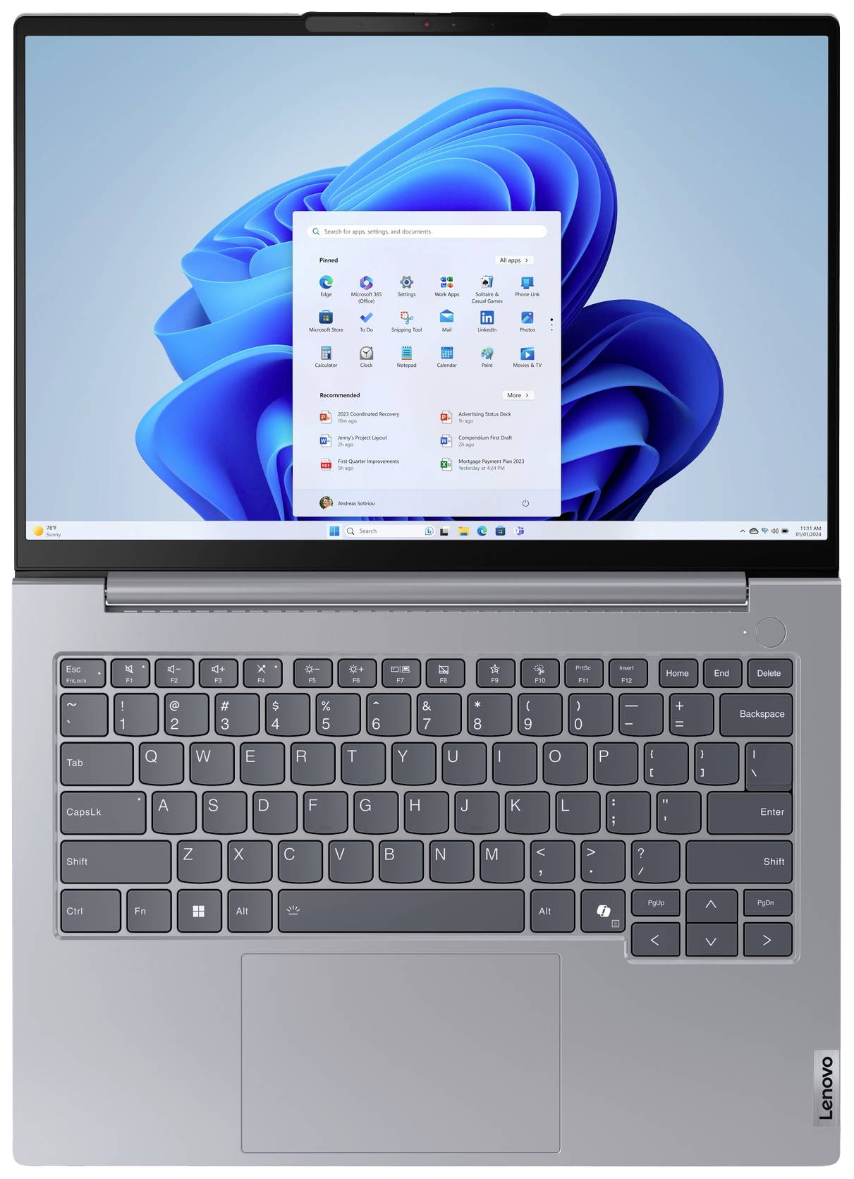 Un laptop con custodia grigia e schermata di avvio di Windows. La tastiera è ben visibile.