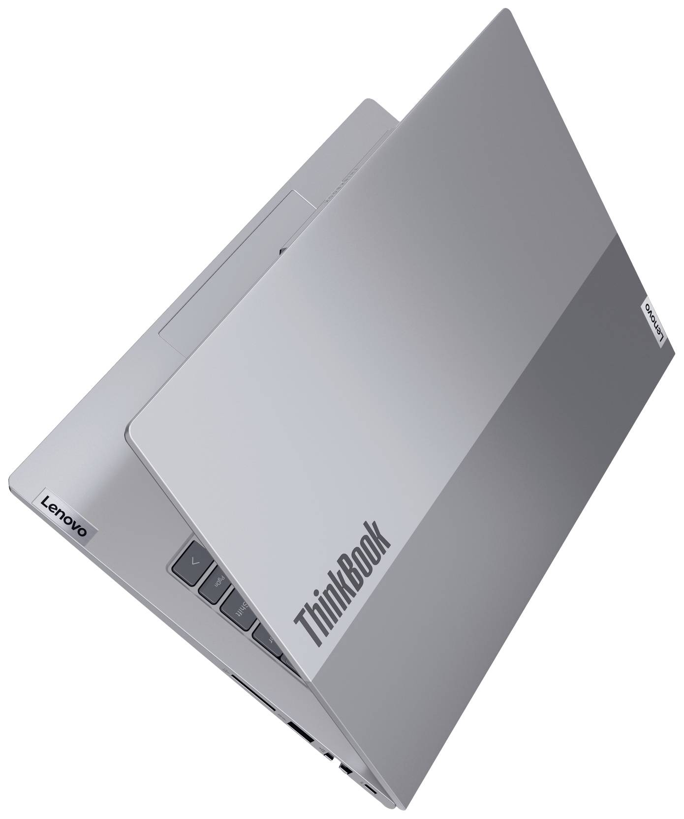 Un notebook grigio argento del marchio Lenovo ThinkBook, parzialmente aperto, mostra un design sottile e moderno con il logo del marchio sul coperchio.