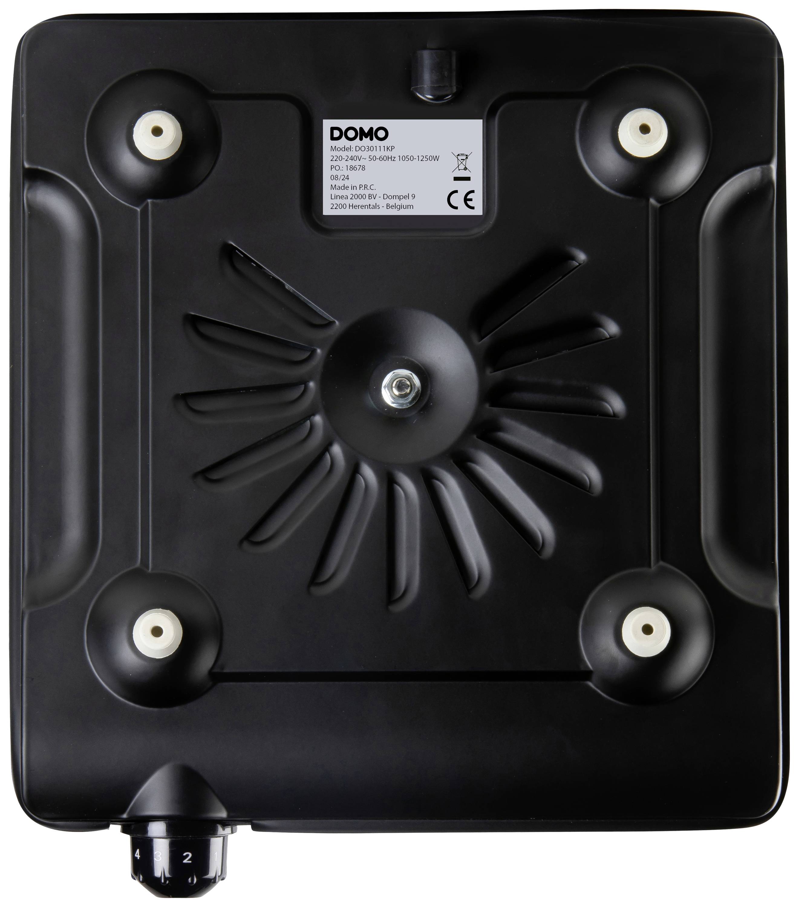 Altoparlante musicale nero, quadrato, con un pulsante centrale in metallo, quattro piedini rotondi e un regolatore del volume in basso a sinistra.