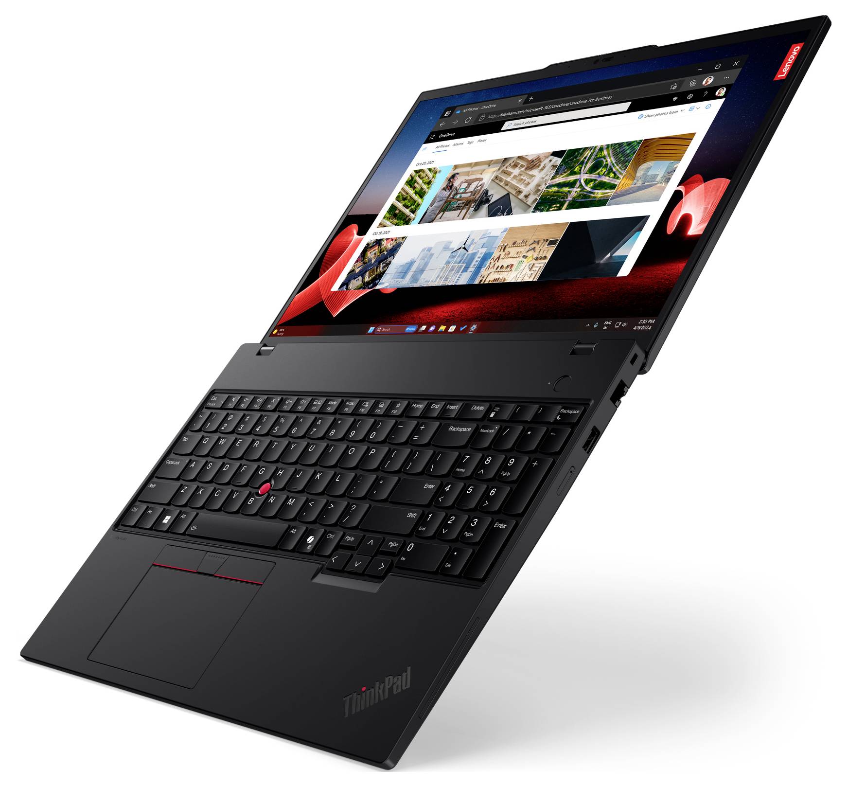 Un laptop nero visto di lato con lo schermo aperto che mostra foto e pagine web. La tastiera è visibile.