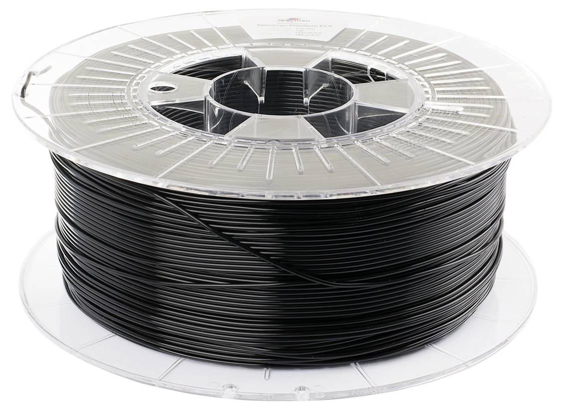 Un rullo di filamento nero per stampanti 3D. Il filo di plastica è avvolto accuratamente sulla bobina trasparente.