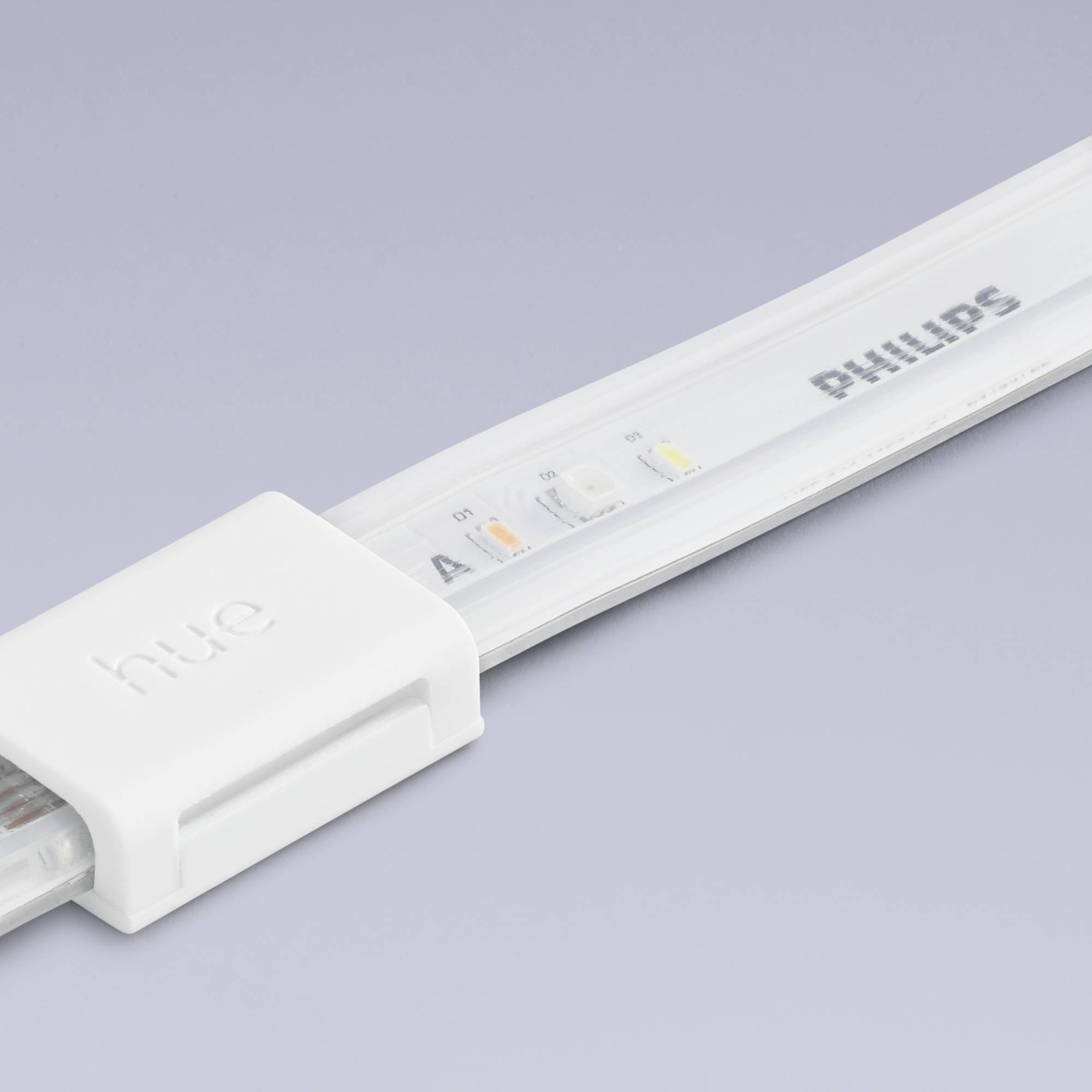 Una striscia LED bianca con la scritta 'Hue' e 'Philips', posizionata su uno sfondo azzurro chiaro.