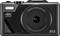 Fotocamera digitale con obiettivo zoom 18x, 64 megapixel e risoluzione 4K. Nome del produttore e numero di modello visibili sulla parte superiore.