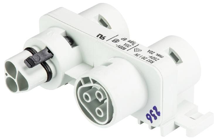 Un connettore elettronico bianco con più porte e marcature, utilizzato nei circuiti elettrici.