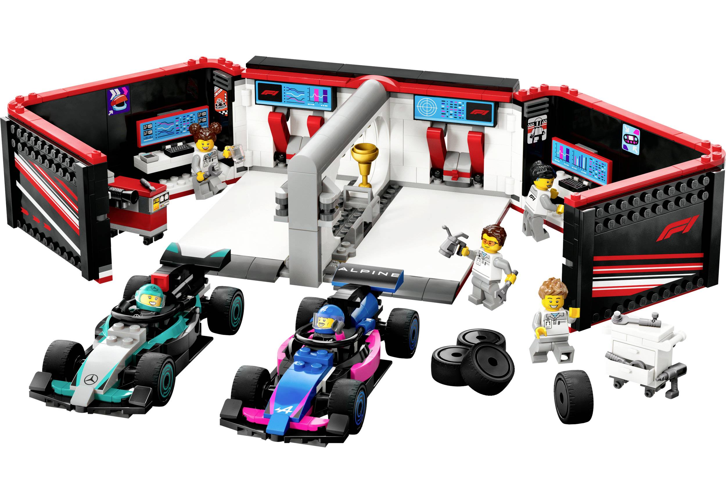 Un set LEGO da corsa con due auto da competizione e personaggi che simulano una scena di officina. Le persone lavorano e interagiscono con gli accessori.