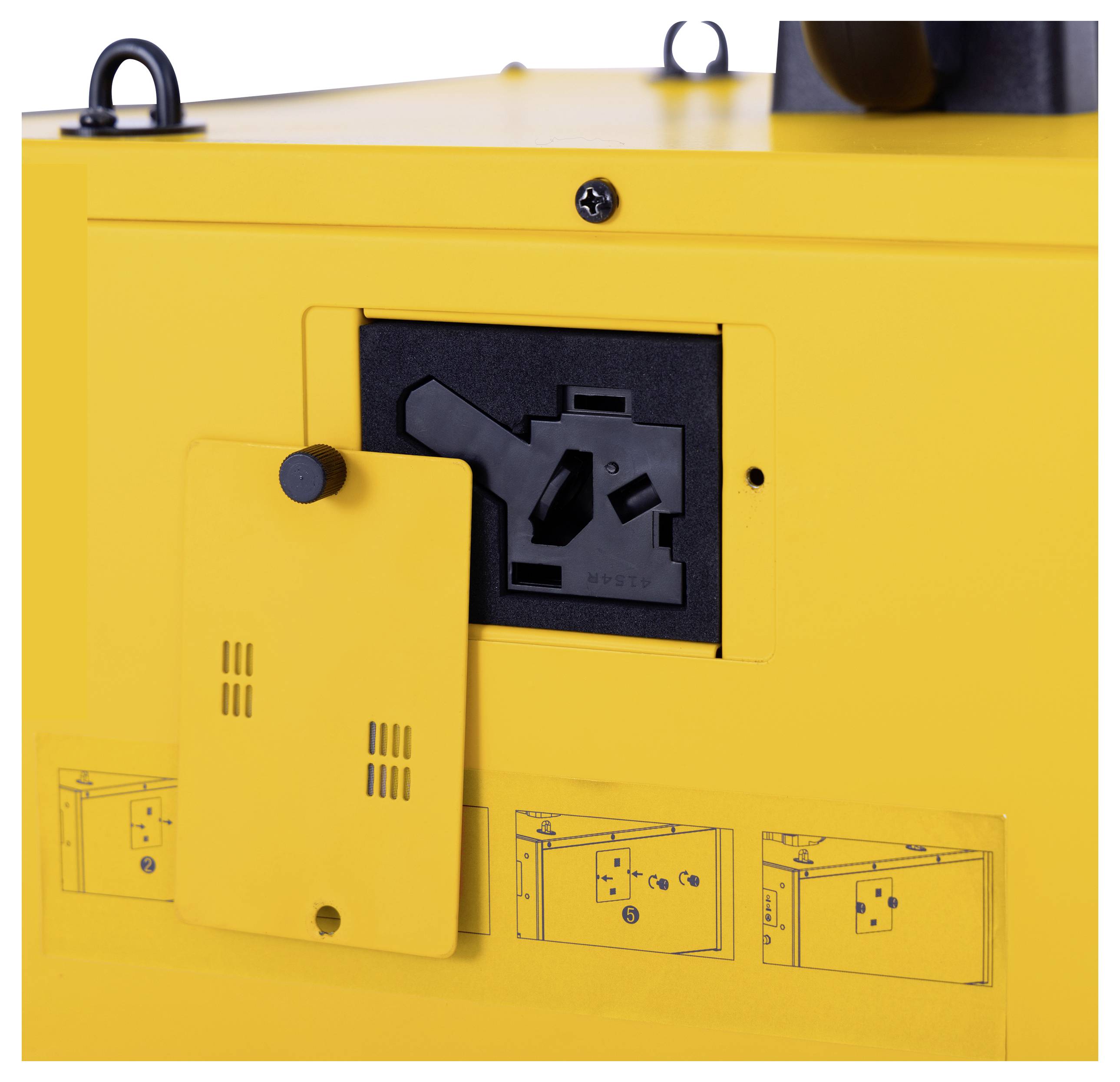 Dispositivo giallo con coperchio aperto, con prese elettriche e interruttori sottostanti. Sulla parte inferiore sono presenti diagrammi per l'utilizzo.