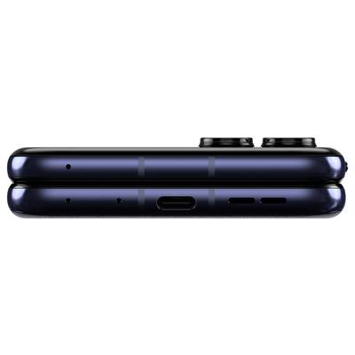Profilo di uno smartphone pieghevole con obiettivi fotografici visibili sulla parte superiore e connettori sulla parte inferiore.