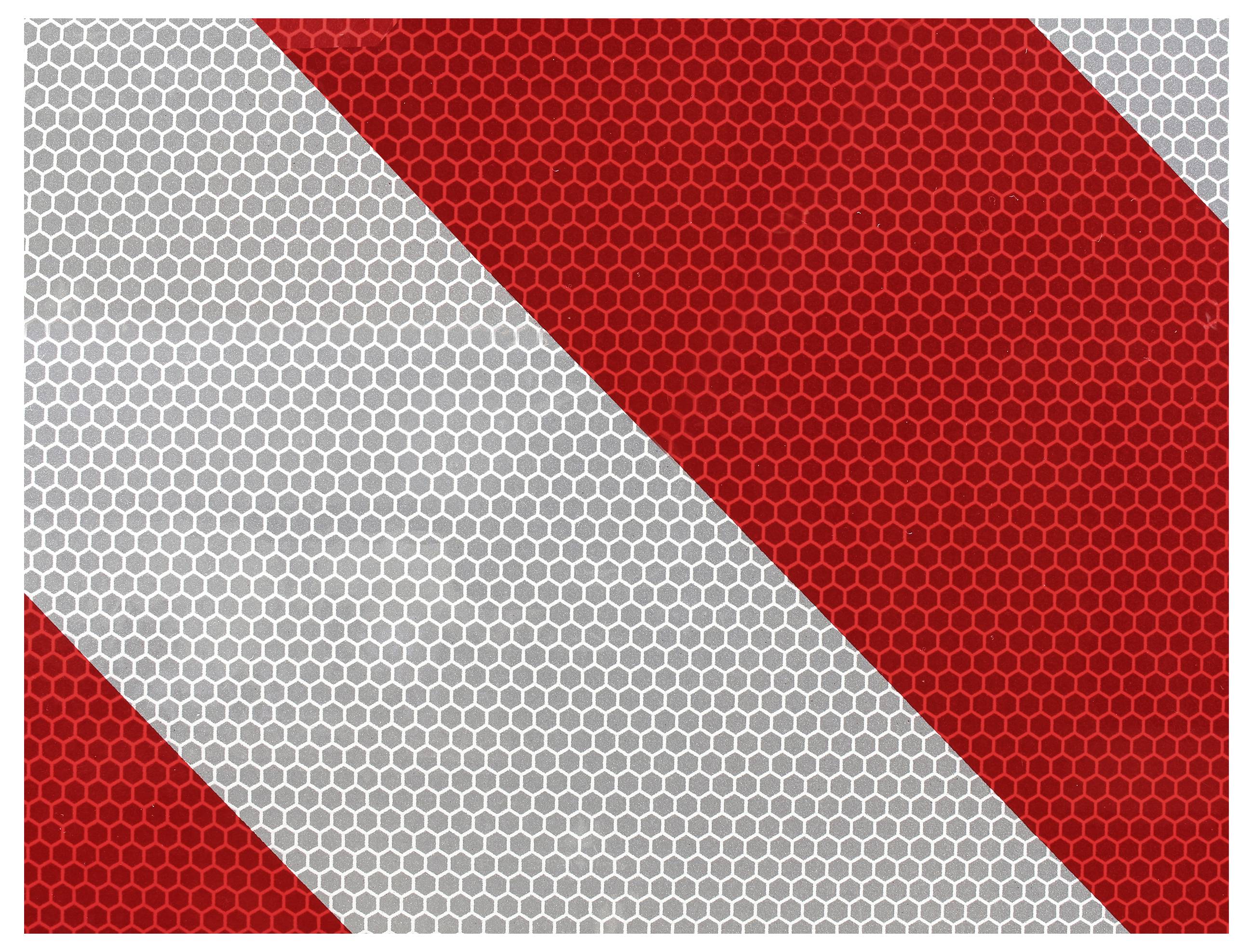 Cartello riflettente di avvertimento con strisce diagonali rosse e argentate, utilizzato per migliorare la visibilità al buio.