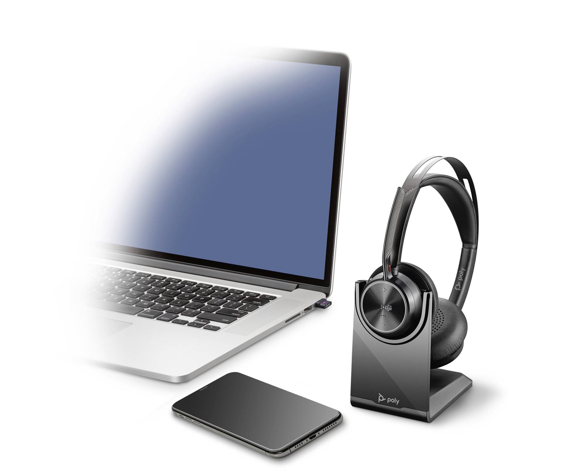 Un laptop, uno smartphone e delle cuffie wireless su un supporto. I dispositivi simboleggiano la tecnologia di comunicazione moderna.