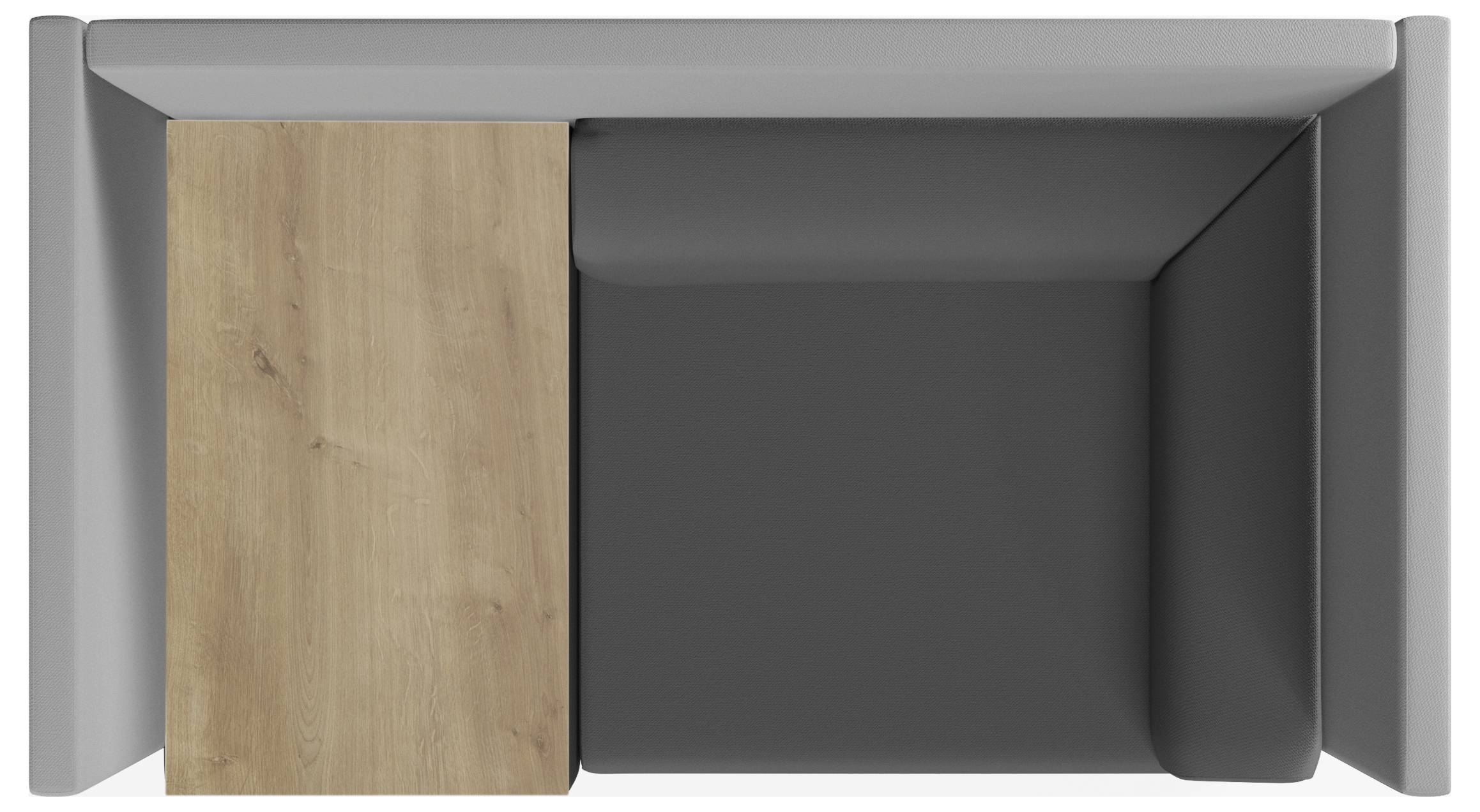 Gruppo di sedute per lounge grigio con un tavolo in legno integrato, vista dall'alto. Perfetto per ambienti di lavoro moderni.