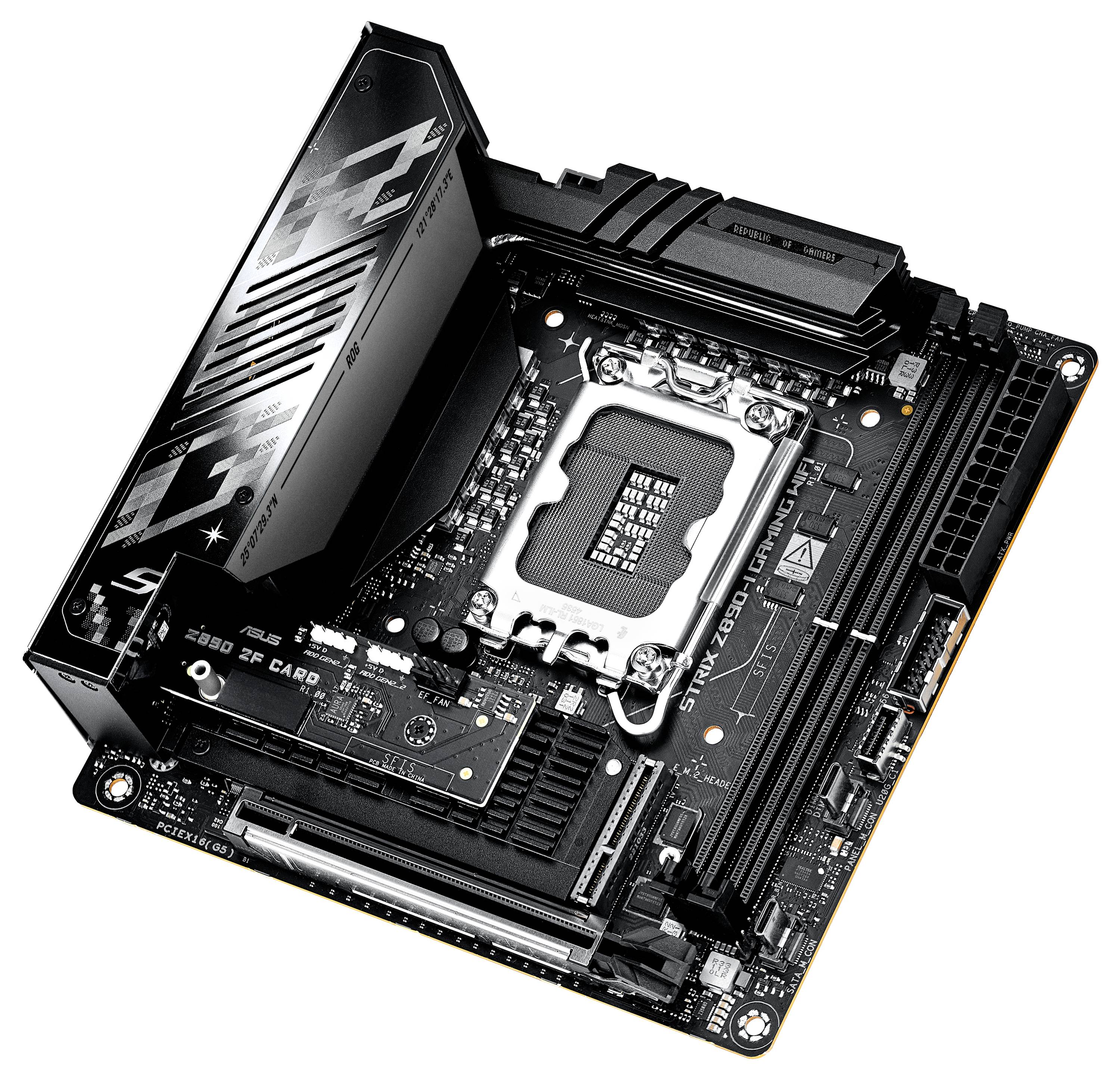 Un motherboard nero e argento è raffigurato. Il design mostra diversi slot e connettori, tra cui un grande dissipatore di calore.