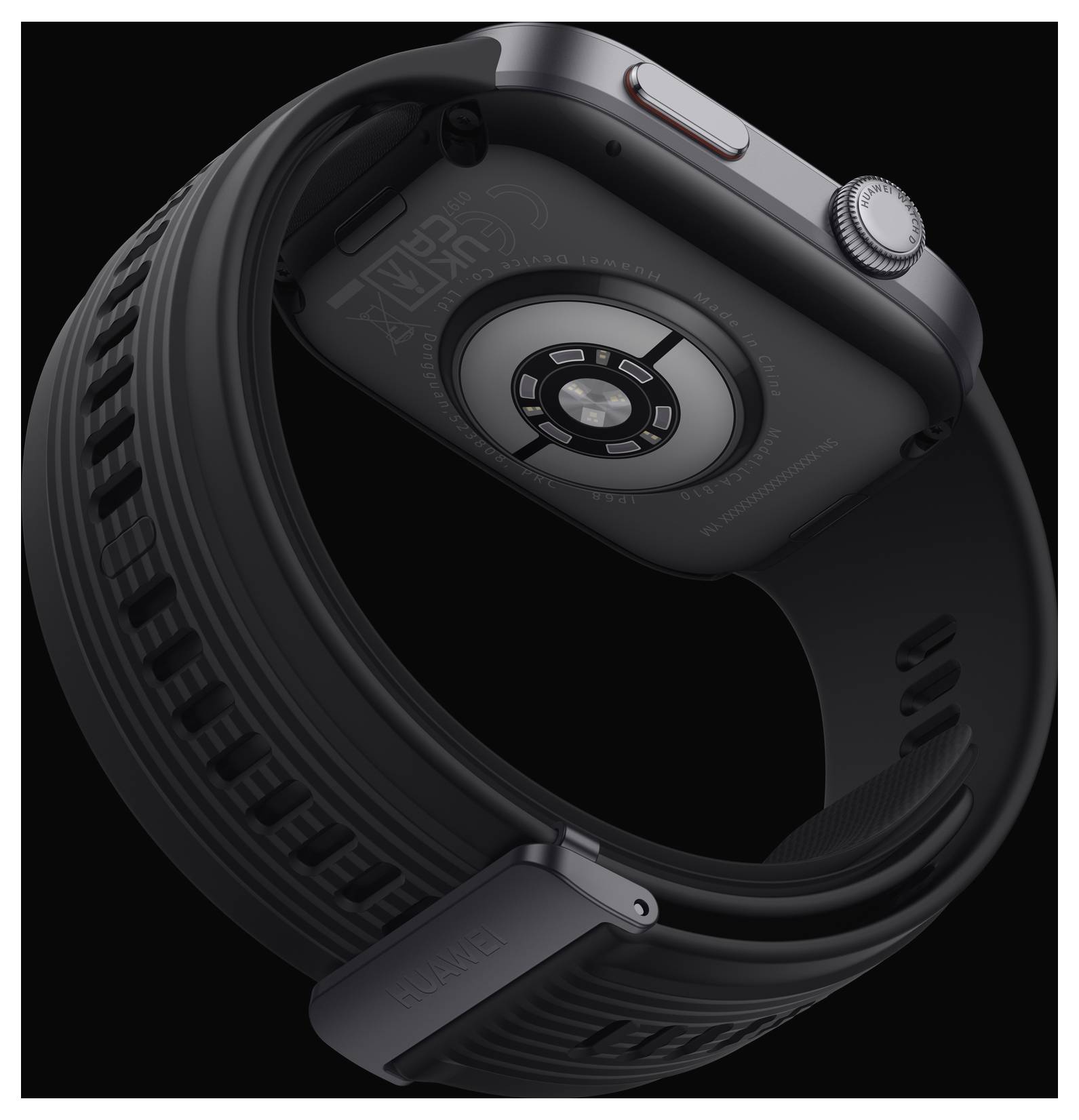 Smartwatch con cinturino nero e cassa argentata, ripresa dal retro, su uno sfondo nero.