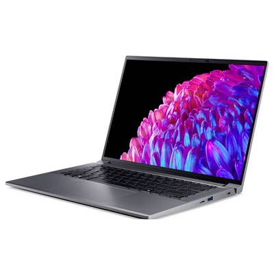 Un laptop con uno schermo vivace e colorato in tonalità di rosa e blu, poggiato su un tavolo.