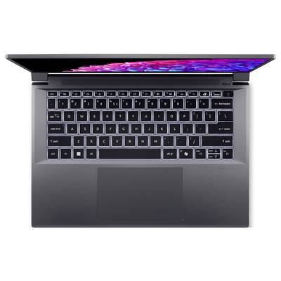 Un laptop aperto con tastiera retroilluminata e display a colori. Il laptop è grigio scuro e presenta un design moderno.