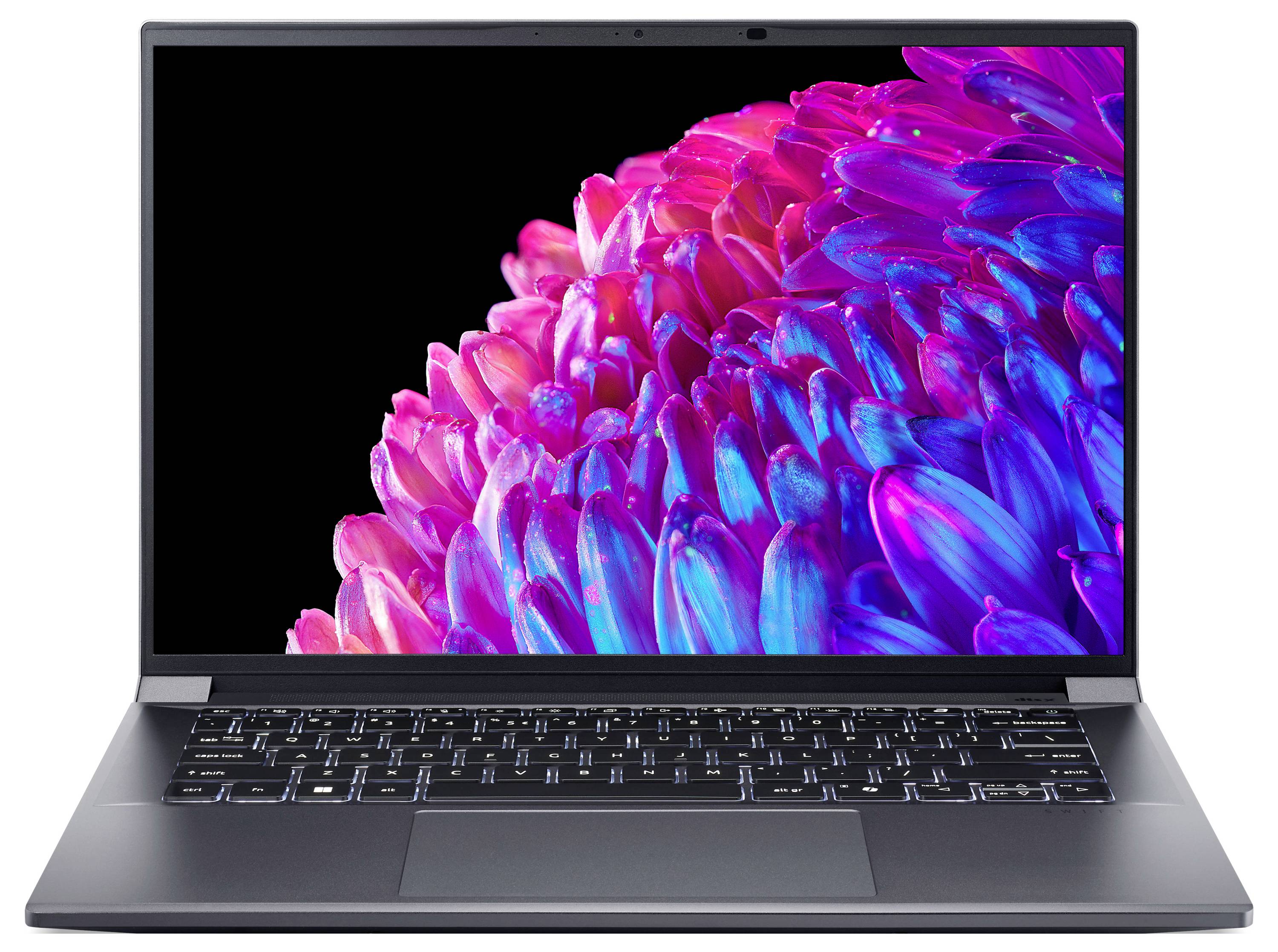 Un laptop mostra un display con un motivo floreale luminosamente rosa e blu. Tastiera e scocca sono in colori scuri.