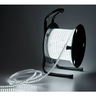 Una striscia luminosa a LED è avvolta intorno a un tamburo nero per cavi, srotolata sul pavimento. Lo sfondo è scuro.