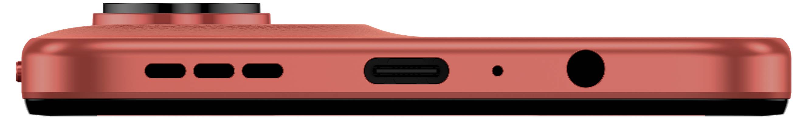 Uno smartphone rosso visto di lato, che mostra il modulo della fotocamera, il pulsante di accensione, la porta USB-C, le griglie dell'altoparlante e il jack delle cuffie.