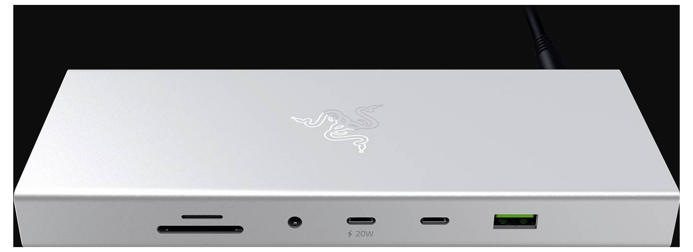 Un dock argentato con più porte, tra cui USB, alimentazione e slot per schede SD. Con un logo sulla parte superiore.