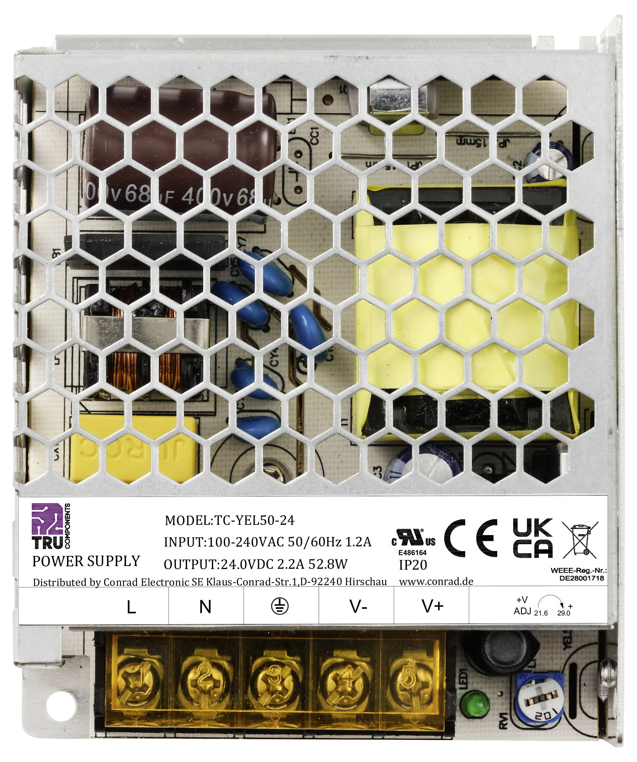 Un alimentatore in custodia metallica con componenti elettronici visibili e un'etichetta che riporta il modello: 'TC-YEL50-24', potenza: 24VDC 2,2A.