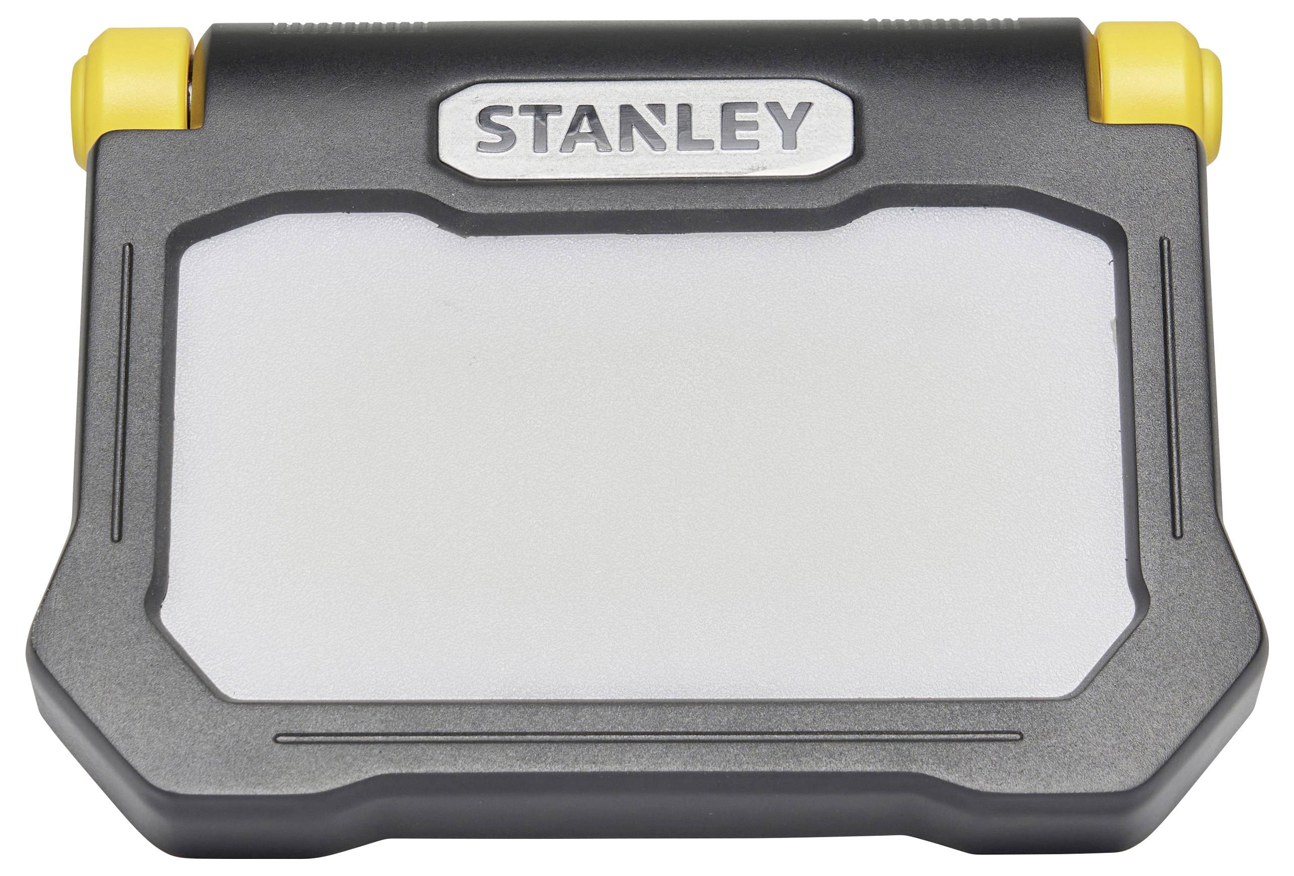 Una lampada da lavoro LED portatile grigia con accenti gialli e il nome del marchio 'Stanley' sulla parte superiore.