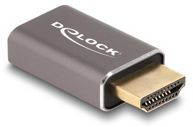 Piccolo adattatore HDMI in involucro scuro con connettore dorato e scritta 'DeLOCK' sulla superficie.
