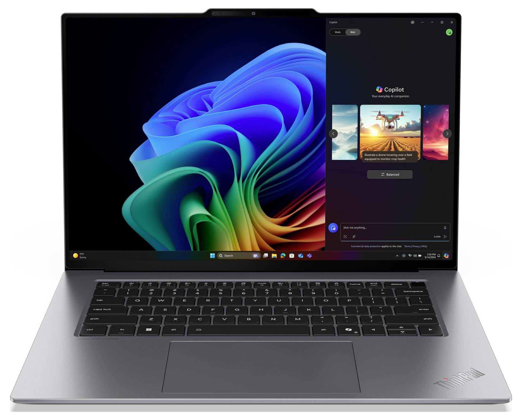 Un laptop con uno sfondo Windows colorato e un'app di editing fotografico aperta che mostra un'immagine di paesaggio.