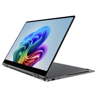 Un laptop aperto con un vivace motivo a spirale colorato sullo schermo, che simboleggia tecnologia moderna e creatività.