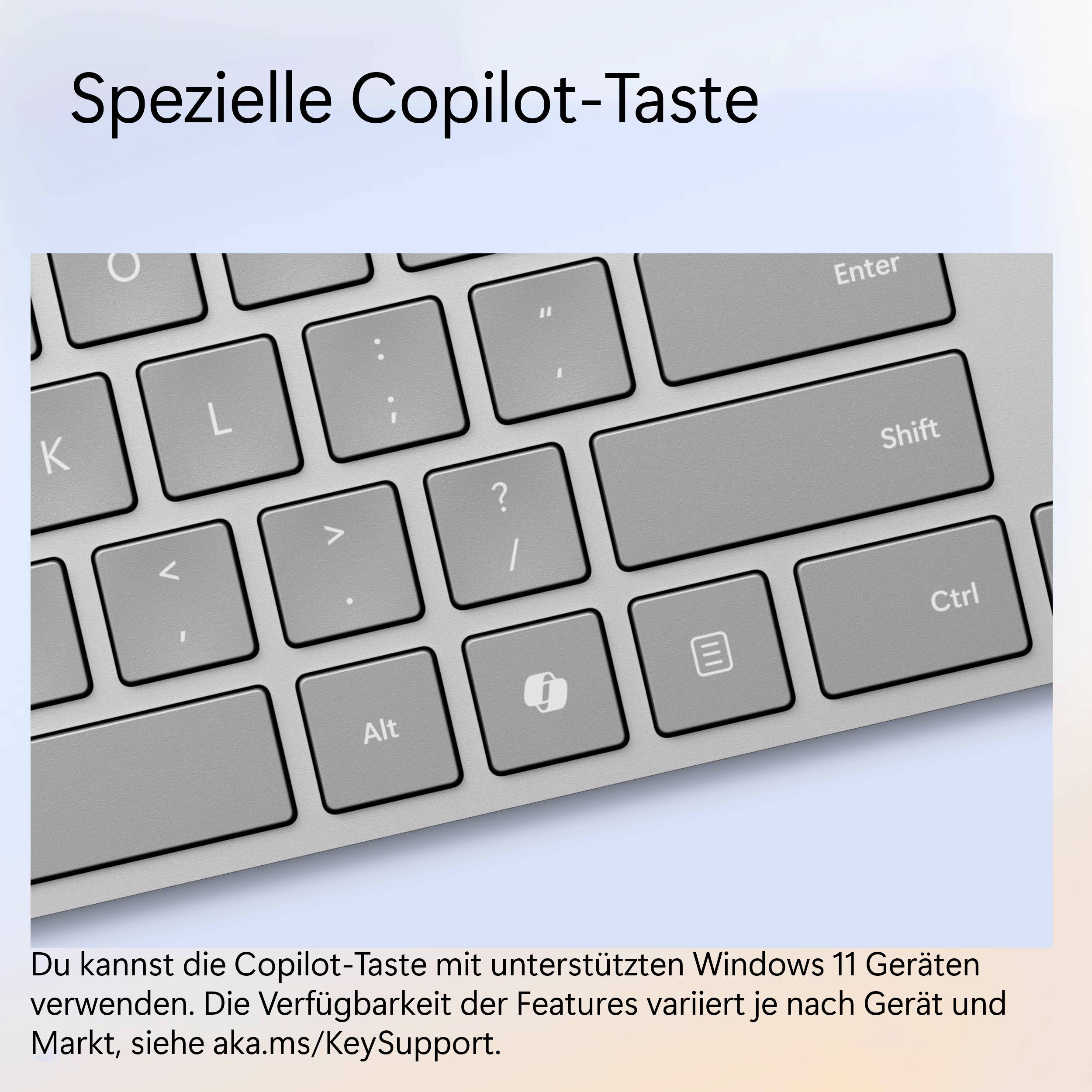 Tastiera con tasto Copilot dedicato per Windows 11. Mostra diversi simboli di controllo su tasti grigi.