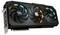 Una scheda grafica nera con tre grandi ventole, un connettore metallico e illuminazione RGB, contrassegnata con 'Gigabyte'.