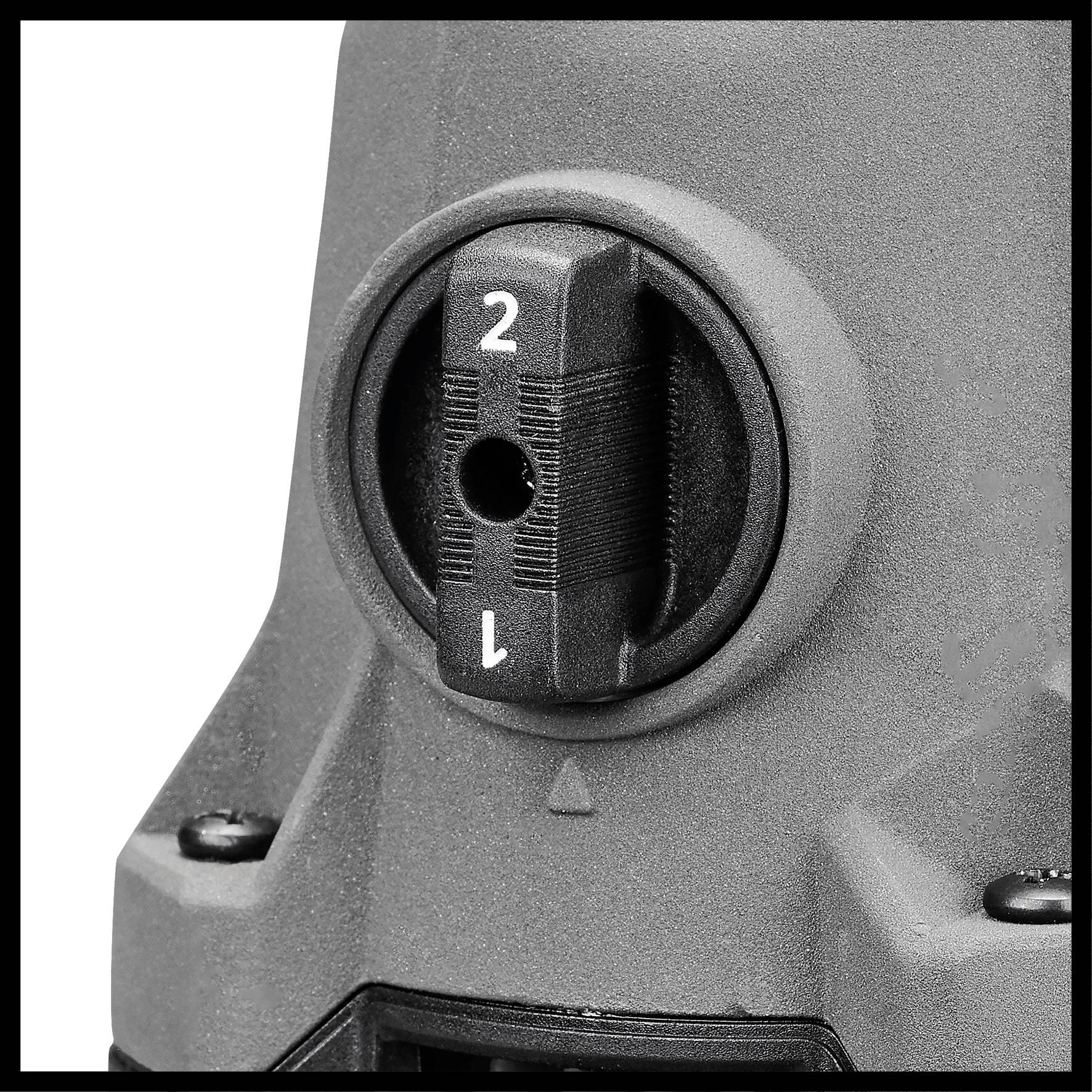 Interruttore grigio con le posizioni '1' e '2' su un dispositivo tecnico per la selezione di diverse opzioni di modalità.