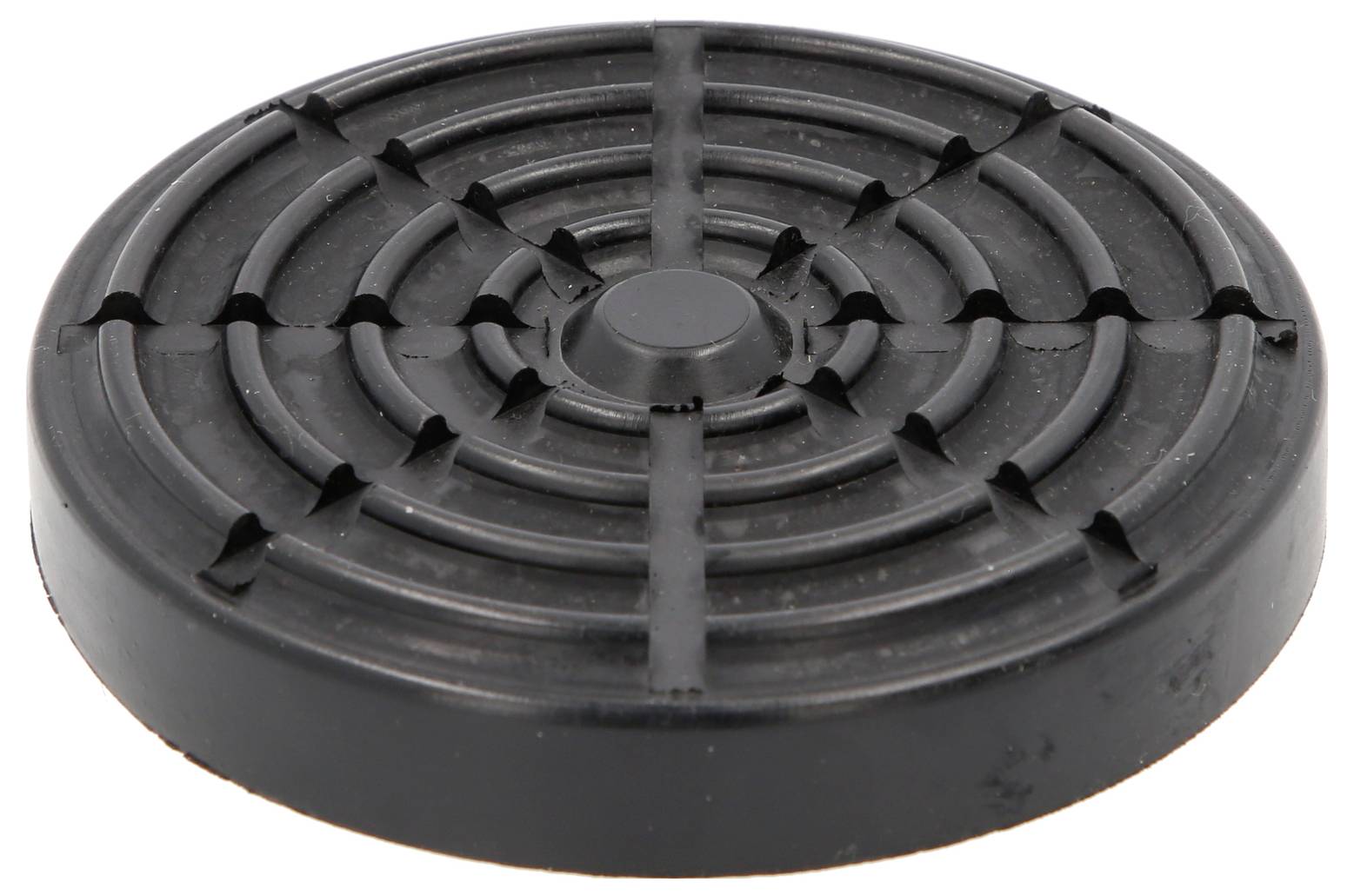 Un piedino rotondo nero in gomma con un motivo a cerchi scanalato, probabilmente utilizzato come base antiscivolo o per proteggere le superfici.