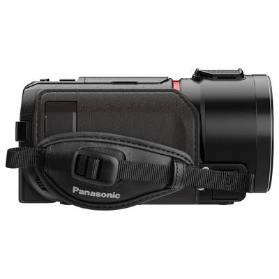 Fotocamera Panasonic nera con impugnatura, vista laterale; dimensioni compatte, adatta per riprese video.