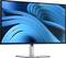 Un ampio schermo del computer con uno sfondo astratto blu. Il monitor è poggiato su un supporto argentato.
