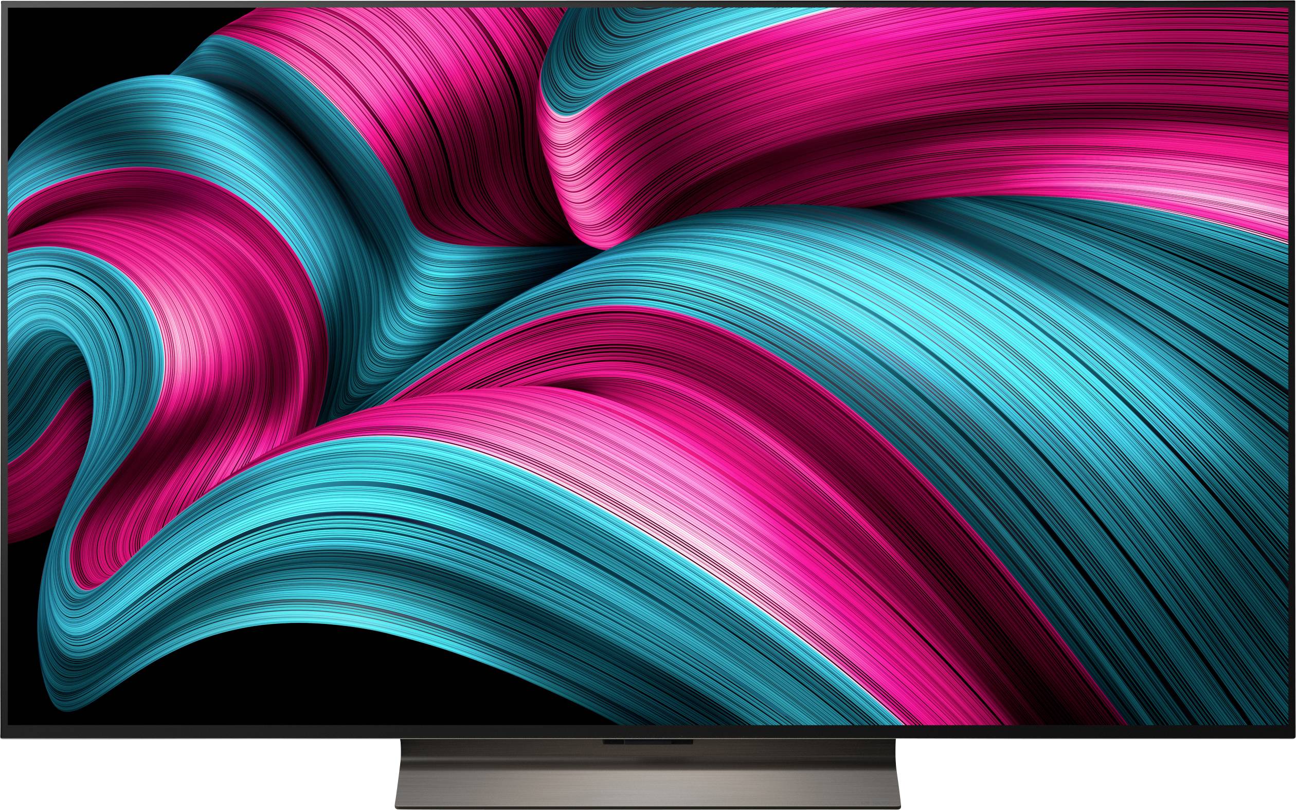 Un'immagine vibrante e astratta con nastri dinamici e vorticosi di verde acqua e magenta su uno sfondo nero, che genera una sensazione di movimento.