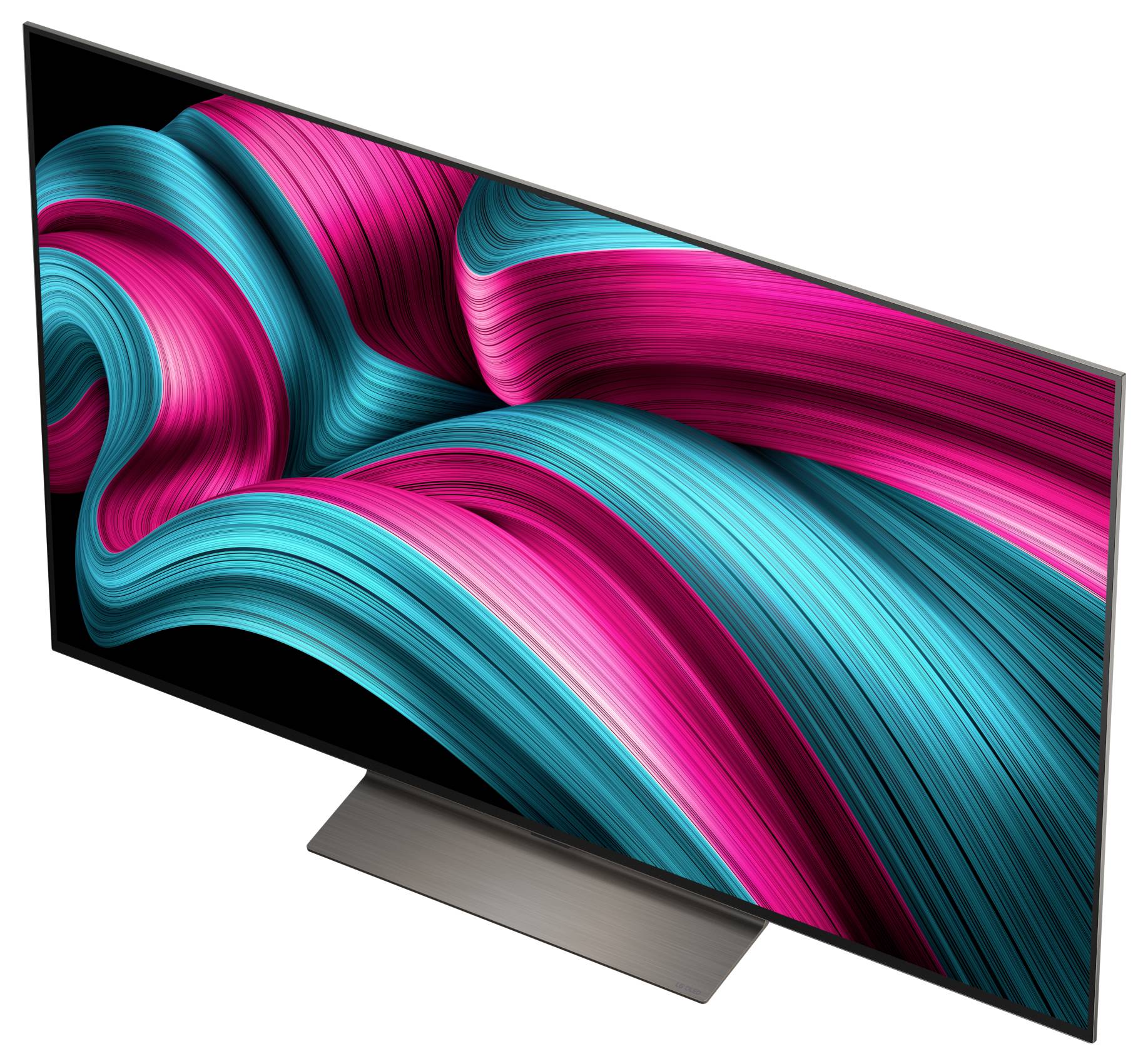 Uno schermo televisivo elegante che mostra vibranti pattern vorticosi di rosa e turchese su uno sfondo nero, poggiato su un supporto minimista.